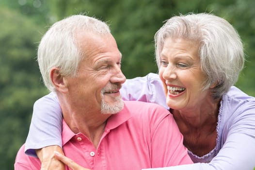 Happy senior couple in a park