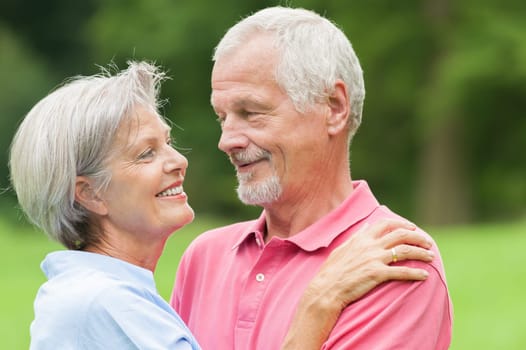 Happy senior couple in a park
