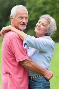 Happy senior couple in a park