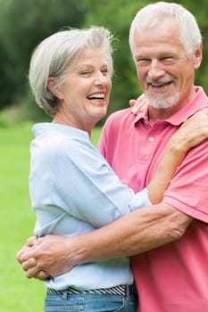 Happy senior couple in a park
