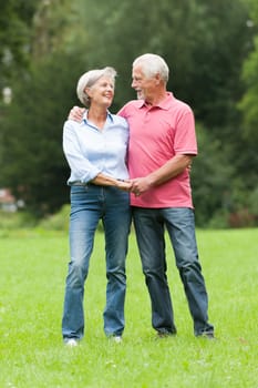 Happy senior couple in a park