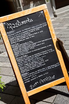 a wooden menu with different food