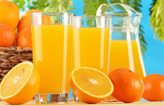 Composition with two glasses of orange juice and fruits
