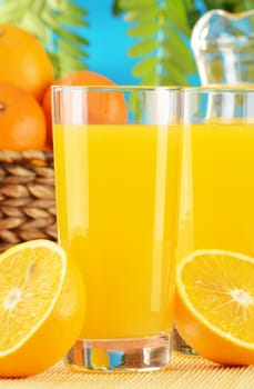 Composition with two glasses of orange juice and fruits