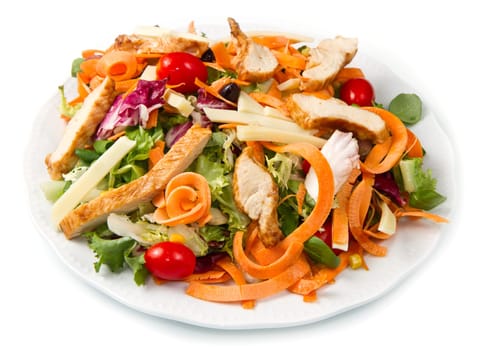 Chicken salad with fresh ingredients in the white bowl