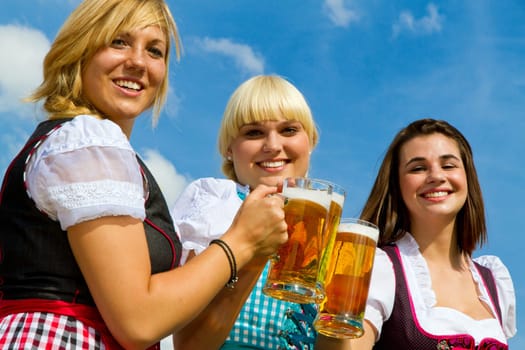 Young women drinking beer