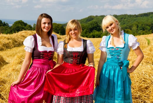 Three girls in dirndls