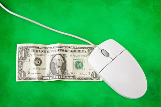 computer mouse placed on one dollar bill