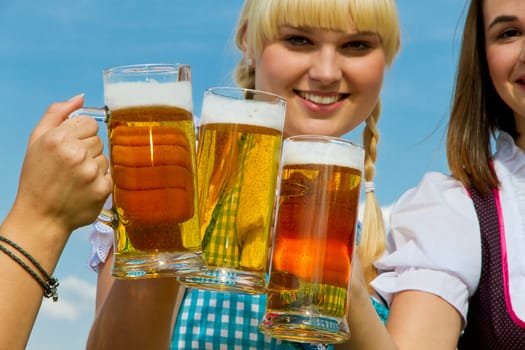 Young women drinking beer