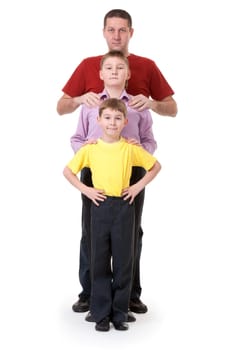 Dad and two sons are in a row on a white background