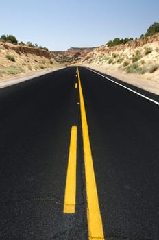 road with black asphalt in Monument Valley in Utah in the United States of America