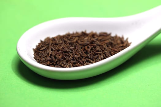 caraway on a porcelain spoon