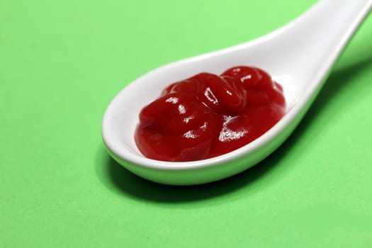 ketchup on a porcelain spoon