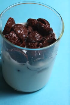 chocolate flakes with milk in glass