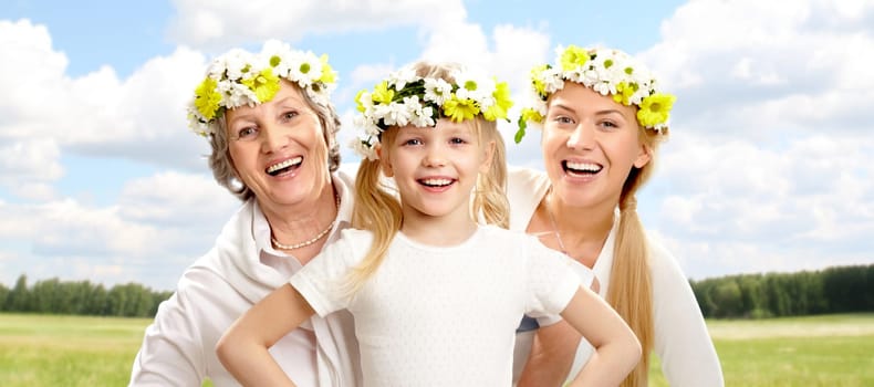 Portrait of grandmother and mother behind for child with smile