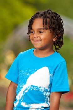 Outdoor portrait of a cute african american little boy