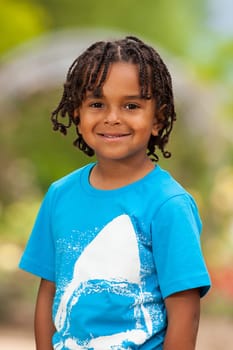 Outdoor portrait of a cute african american little boy
