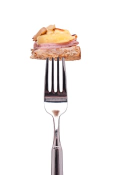 Hawaiian toast with pineapple and ham on a fork
