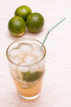 Non-alcoholic cocktail with ice cubes and limes