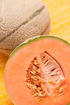 Sliced half Charentais melon with seeds