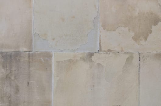 Wall with joints and chipped plaster