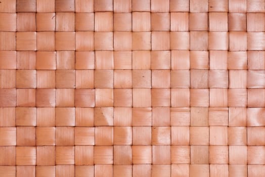 Brown background of braided dried palm leaves