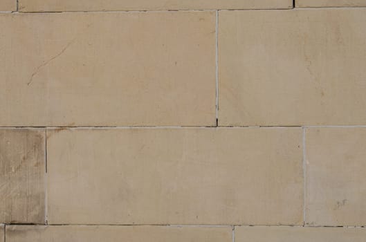 Stone wall made of sandstone and several ashlars
