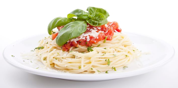 fresh delicious spaghetti with tomato sauce basil and parmesan isolated on white background