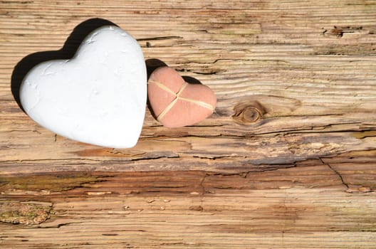 2 hearts on an old wood background