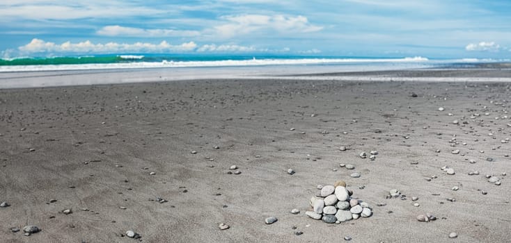 Medewi beach with black volcanic sand