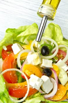 Feta salad with tomatoes, black olives  and fresh vegetables