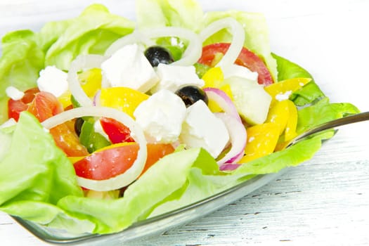 Feta salad with tomatoes, black olives  and fresh vegetables