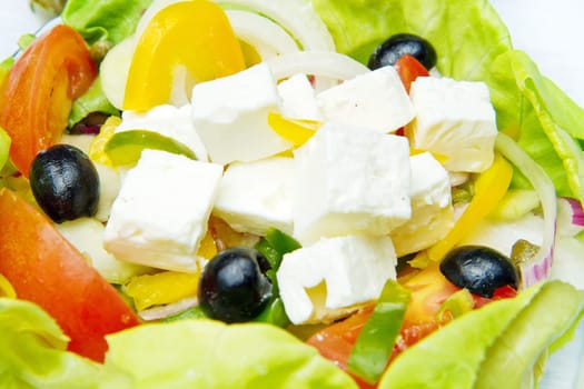 Feta salad with tomatoes, black olives  and fresh vegetables