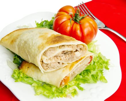 tuna sandwich on fresh salad and tomato