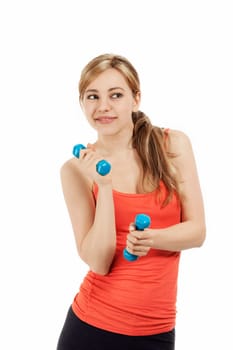 Cute sportswoman playing with her fitness dumbbells on white background