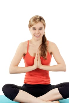 Happy young woman doing yoga on white background