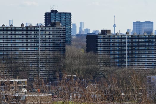 View over suburb Vlaardingen, the Netherlands, with appartment buildings and skyline Rotterdam with Euromast in background