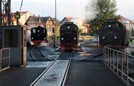 Steam locomotives are waiting to be dispatched at the turntable