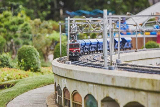 Toy train in a miniature city in Madurodam park, Netherlands.