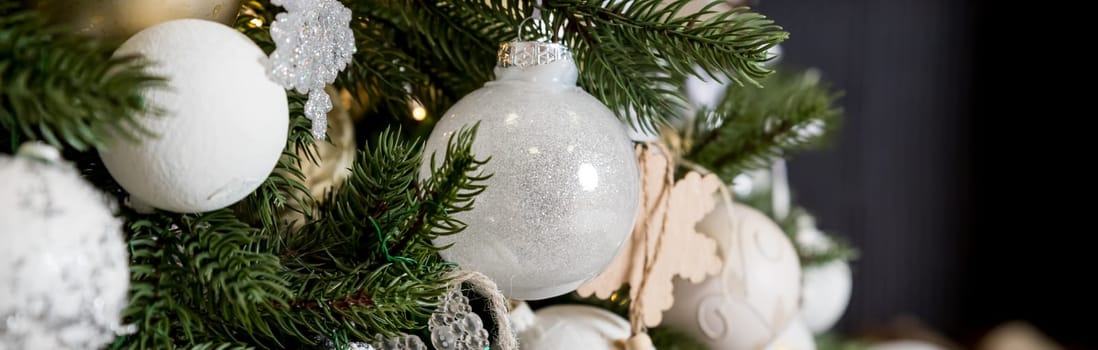 Handmade Christmas tree decoration hanging on Xmas tree with dried apple, leather, and wooden toys.