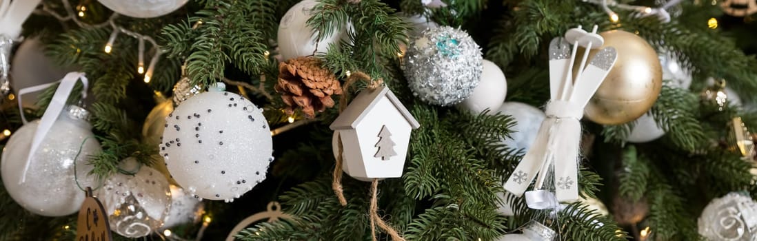 Handmade Christmas tree decoration hanging on Xmas tree with dried apple, leather, and wooden toys.