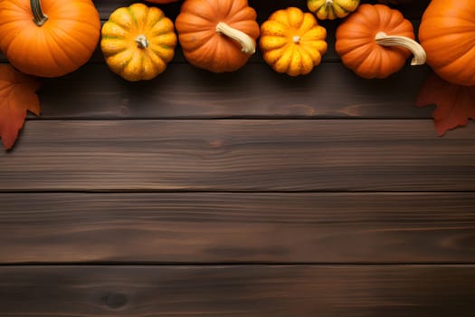 Beautiful warm autumn background decoration made of pumpkins on a dark noble wooden background. Flat layout. view from above. autumn concept, Thanksgiving. copy space