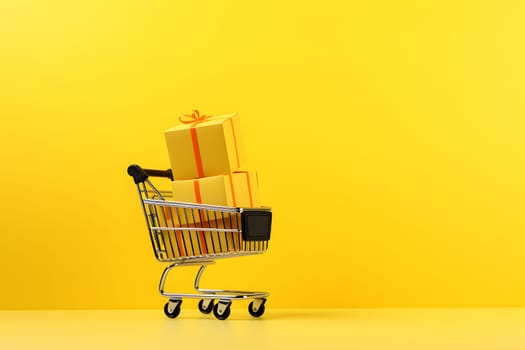 A creative concept with a shopping cart with gifts on a yellow background. A gift wrapped in kraft paper with a red ribbon. Black friday. A surprise gift,