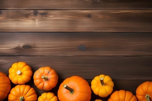 Beautiful warm autumn background decoration made of pumpkins on a dark noble wooden background. Flat layout. view from above. autumn concept, Thanksgiving. copy space