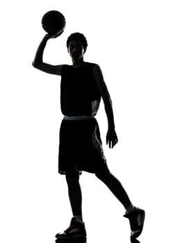 one young man basketball player silhouette in studio isolated on white background
