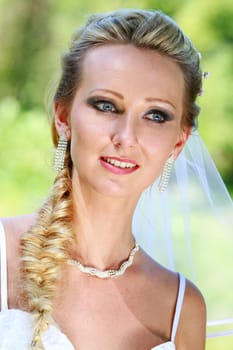 Face Portrait of happy Bride the park