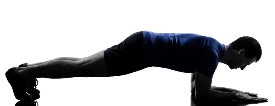 man exercising push ups workout fitness aerobics posture in silhouette studio isolated on white background