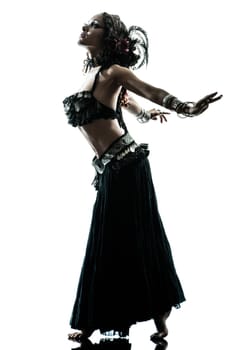 one arabic woman belly dancer dancing silhouette studio isolated on white background