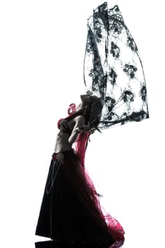 one arabic woman belly dancer dancing silhouette studio isolated on white background