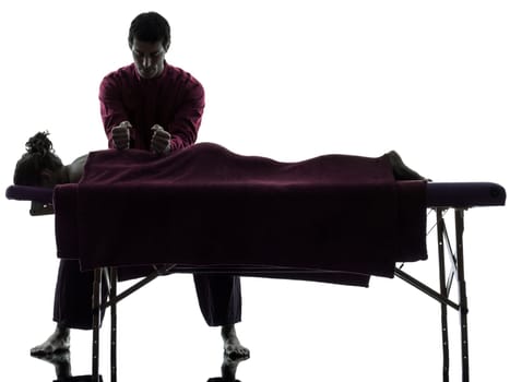 man woman back massage in silhouette studio on white background